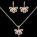 elegance and charm to your look with this stunning bow jewelry set